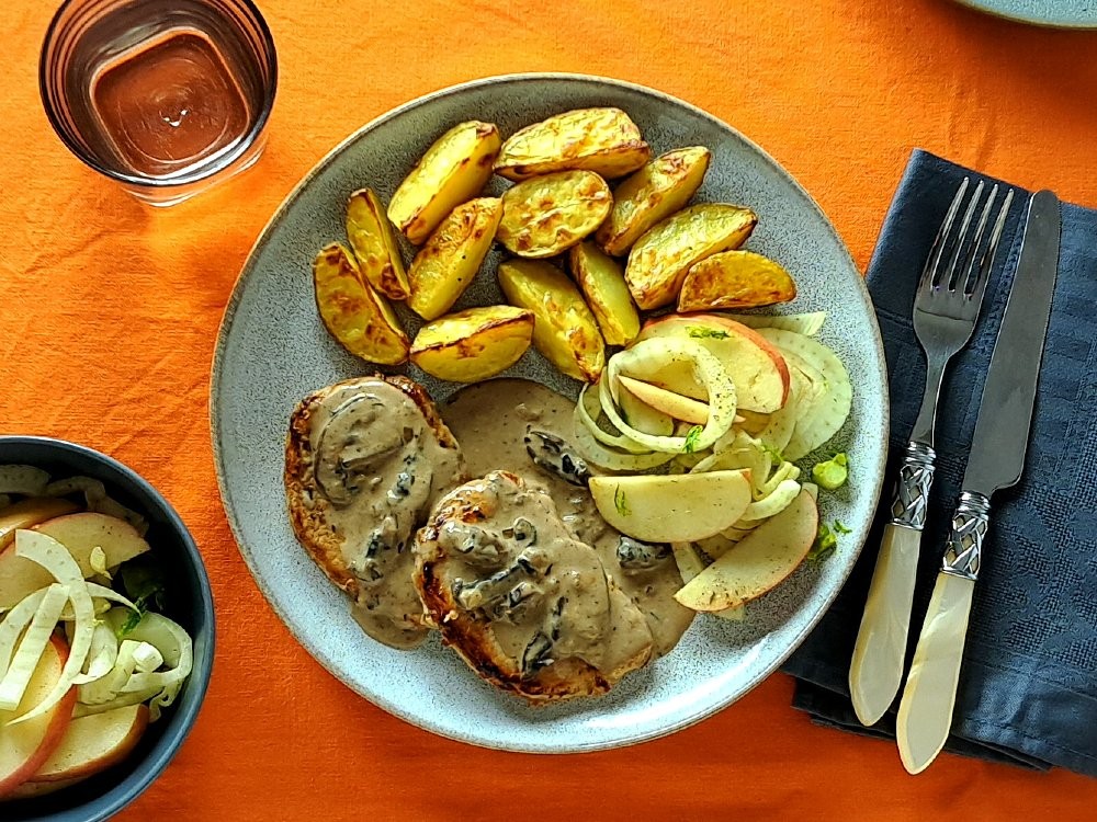 Schweinerückensteak mit Champignonsoße